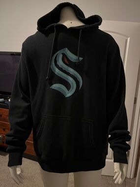 Red Jacket Black Hoodie with Teal and Rust 'S' Graphic